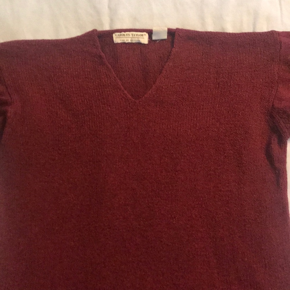 Burgundy sweater.